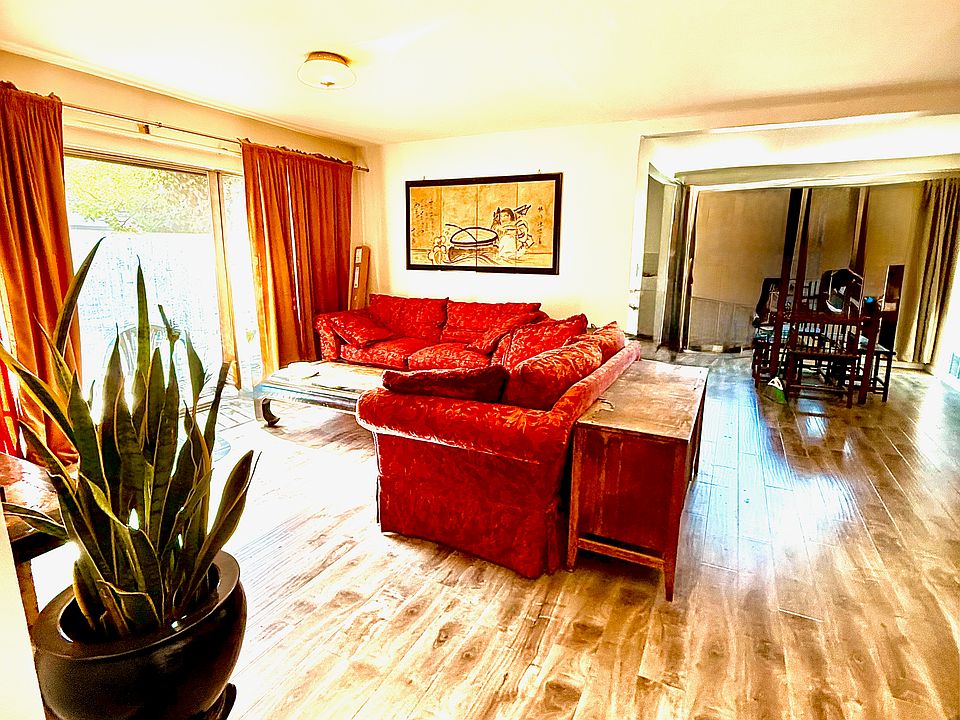Large Living Room with lovely view. Example shown furnished. Unit comes unfurnished.