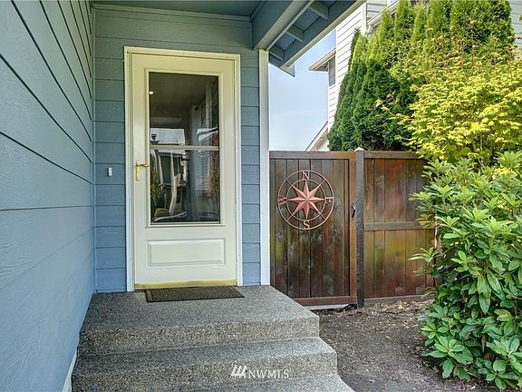 Covered Entry With Side Gate to Backyard.