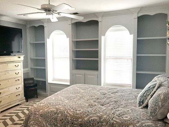 bedroom with built ins