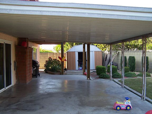 Huge Covered Patio Exiting Frech Sliding Doors off Familyroom