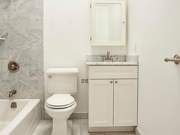 Marble bathroom with full tub