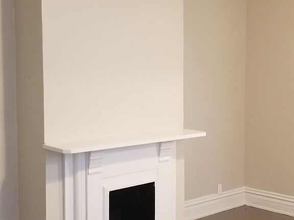 Dining room with inoperable fireplace.