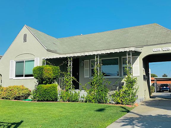 The front of house and well manicured front yard and garden is your view