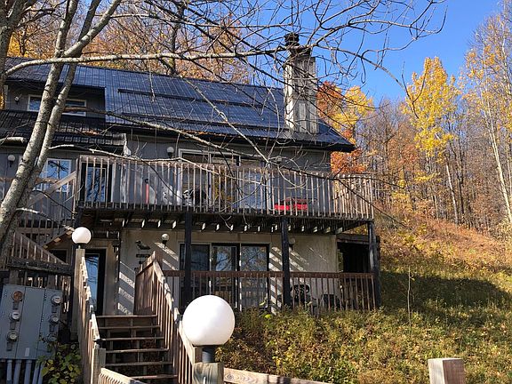 steps up to chalet. Three bedroom unit consists of the top two floors. Additional one bedroom on bottom floor available for additional fee.