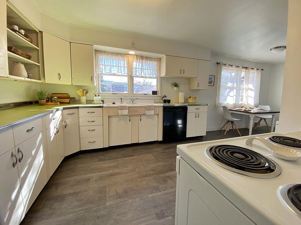 Amazingly maintained original kitchen. Includes electric range, dishwasher, disposal, microwave, and refrigerator. Nostalgic charm without compromising function.
