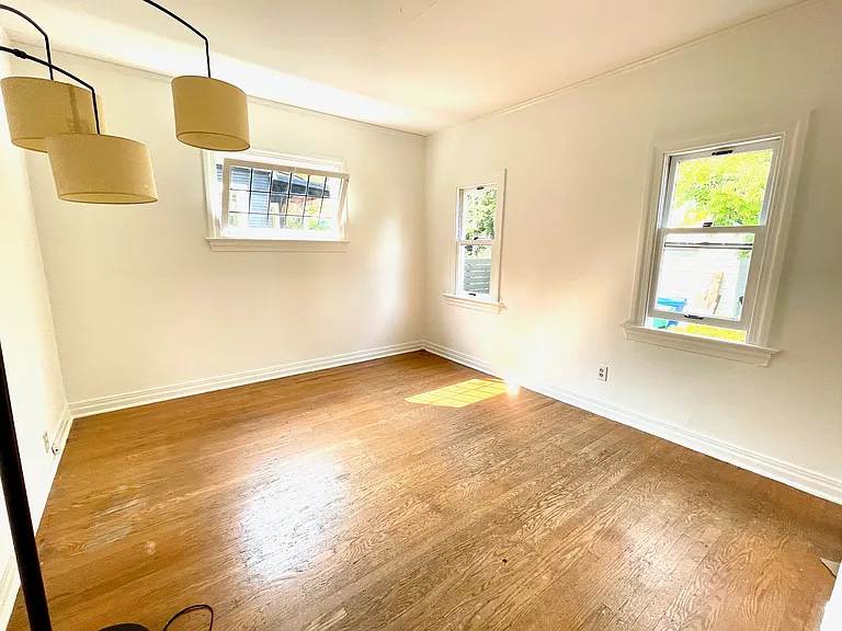 2nd downstairs bedroom, windows toward backyard