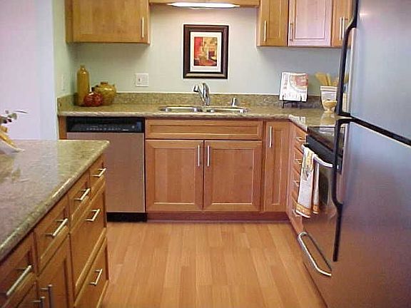 Kitchen with Stainless Steel appliances, granite counters and Pergo-like floor