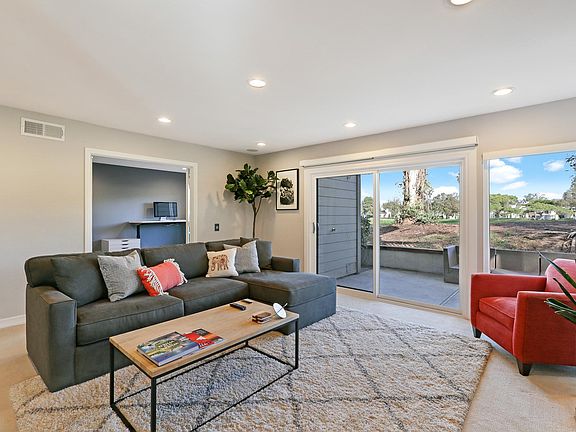 Large living room with gas fireplace. Great for entertaining