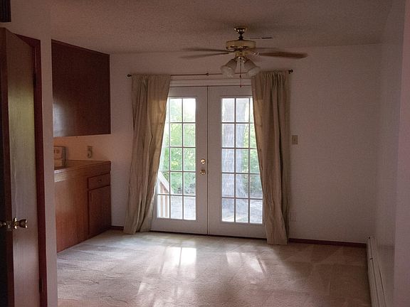 Dining room with kitchen to the left.