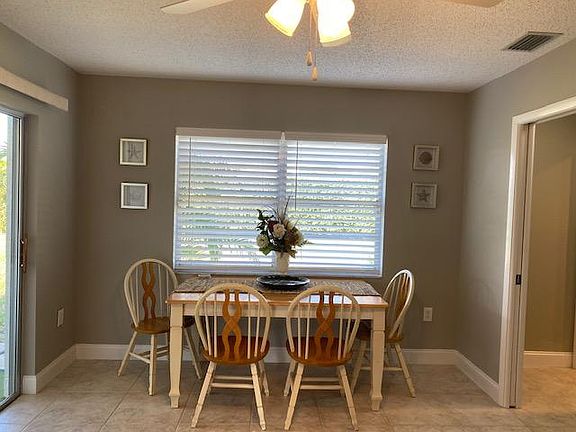 Eat-in Kitchen/Family rm with slders leading to screened patio on large corner lot.