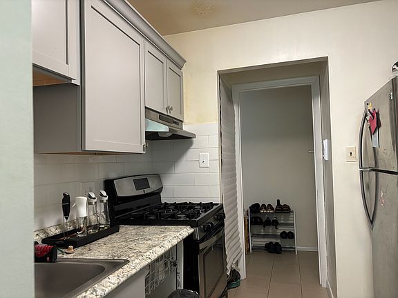 Stainless steel appliances and new cabinetry. Ample storage space which includes a pantry and cabinets on both sides of the kitchen.