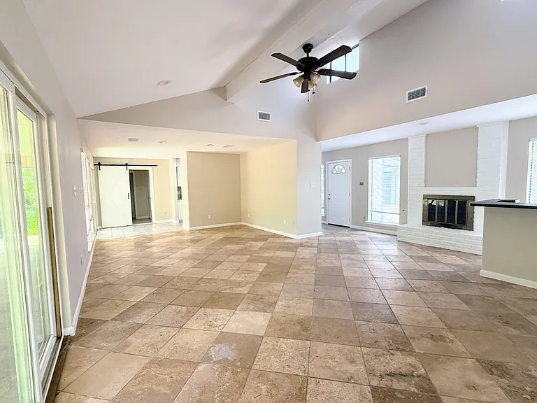Living and dining duo with abundant natural light and soaring ceilings.