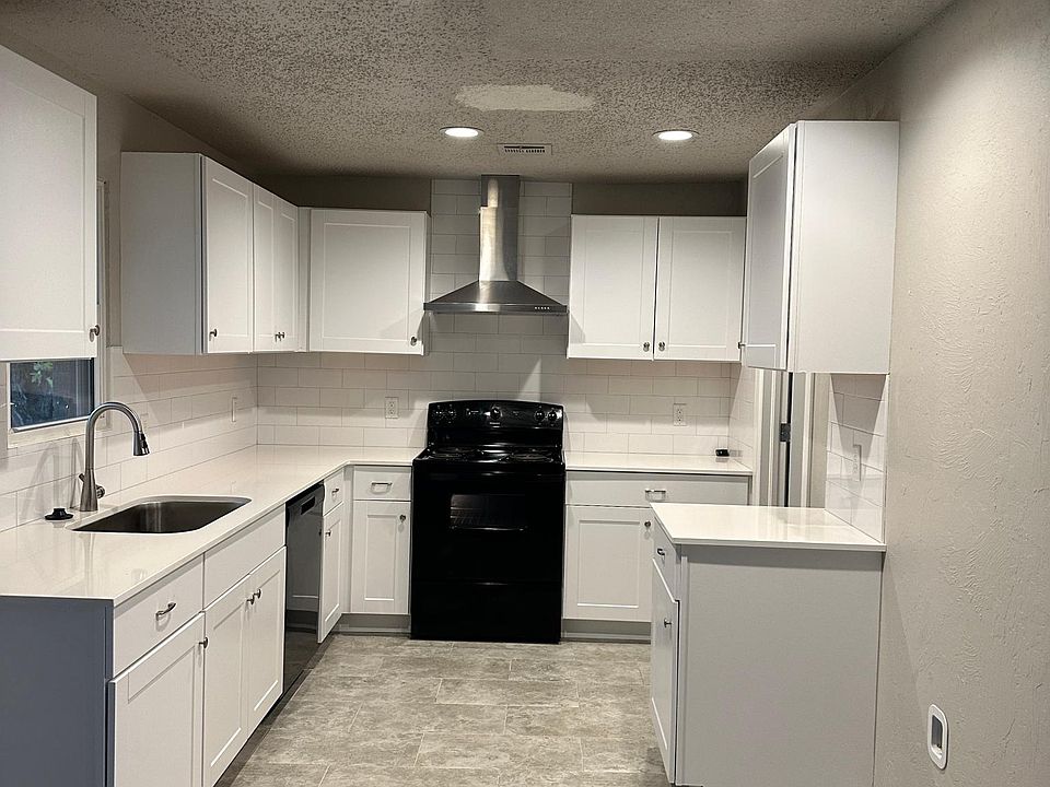 Kitchen with quartz kitchen counters
new cabinets and appliacnes