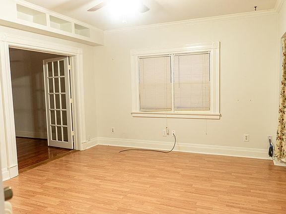 Large family room with large bay windows on the right