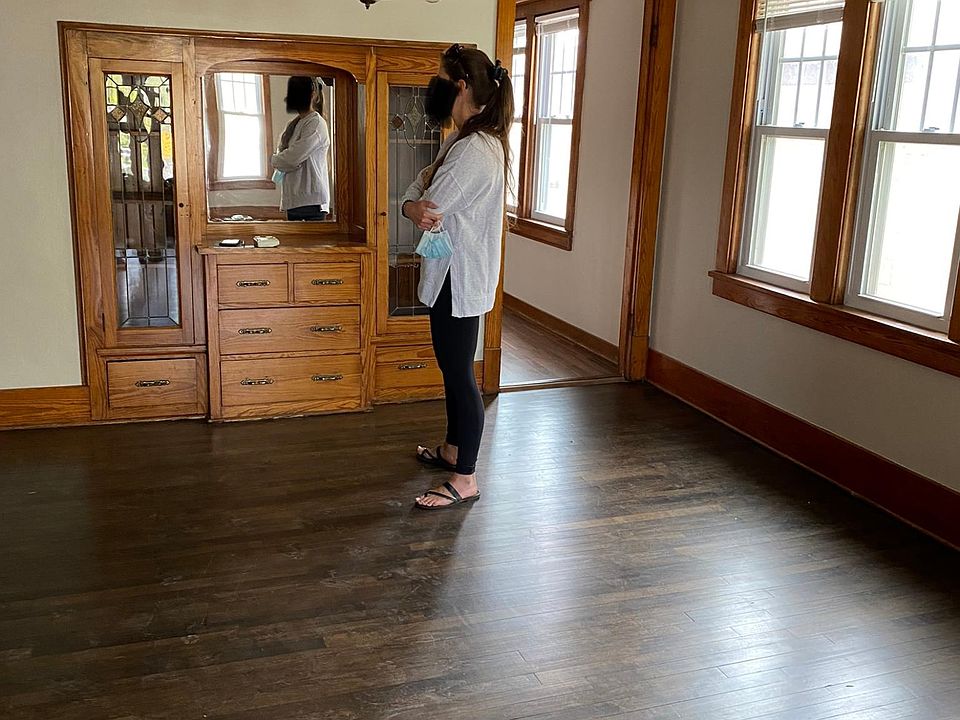Dining room w/ built in buffet and entrance to kitchen on right