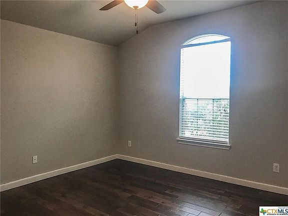 Second bedroom upstairs with walk-in closet.