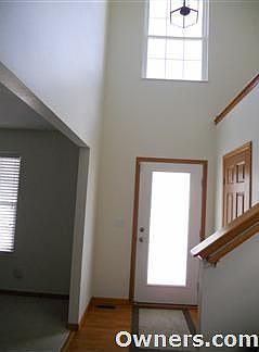 Enter the 2-story foyer with plant ledge