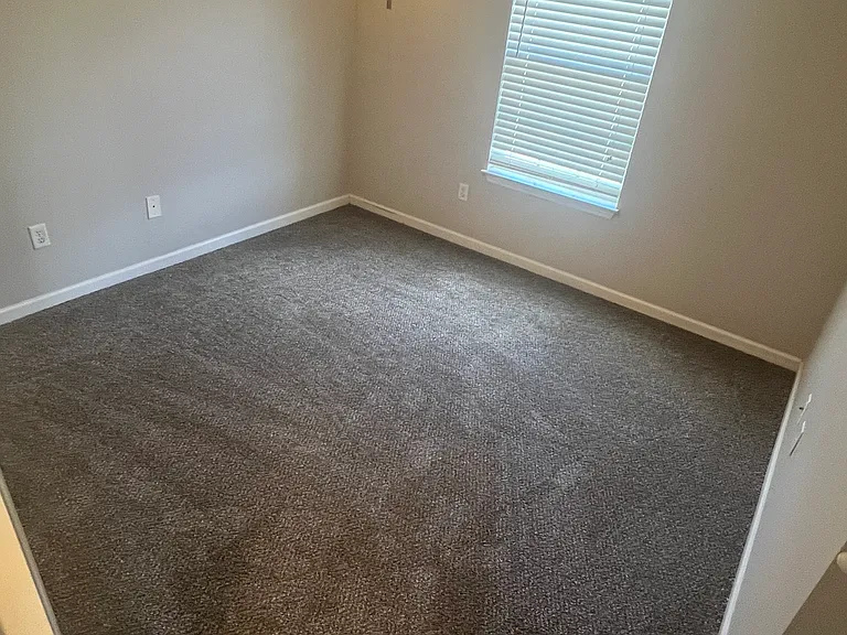 2nd Bedroom with freshly painted walls and brand new carpet