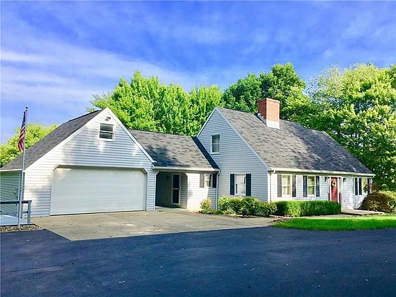 23x22 Two Stall detached garage connects via a breeze way for convenience. The garage has loads of storage in the pull down atti