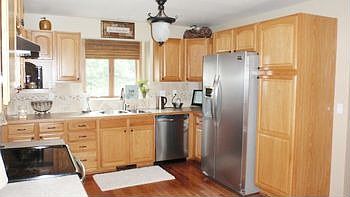 Great Updated Kitchen with Stainless Steel Appliances, Newer light fixtures, Hardware & Hickory Wood Floors.