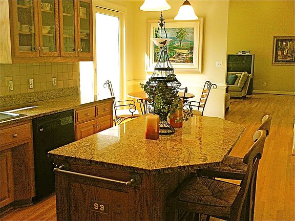 Kitchen Looking into the Breakfast Room and Family Room