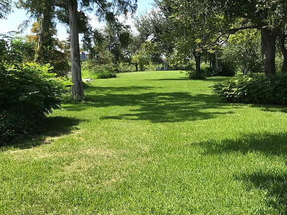 Large front yard leading to bayou