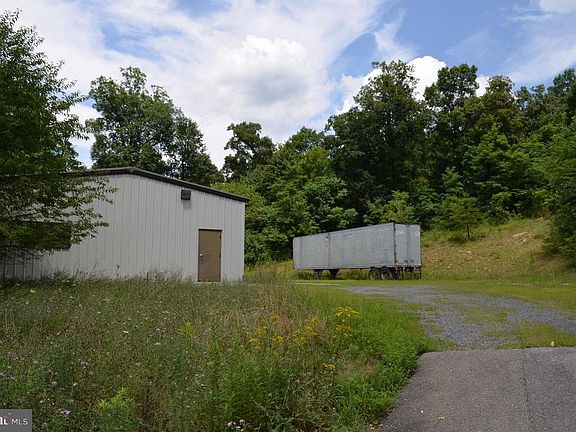 Long driveway to warehouse at top of hill