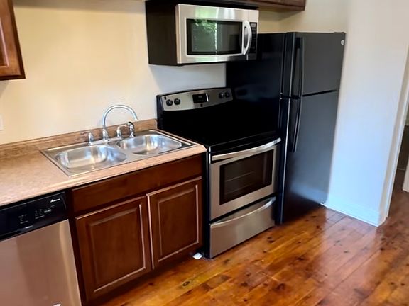 Full sized stainless steel/black appliances