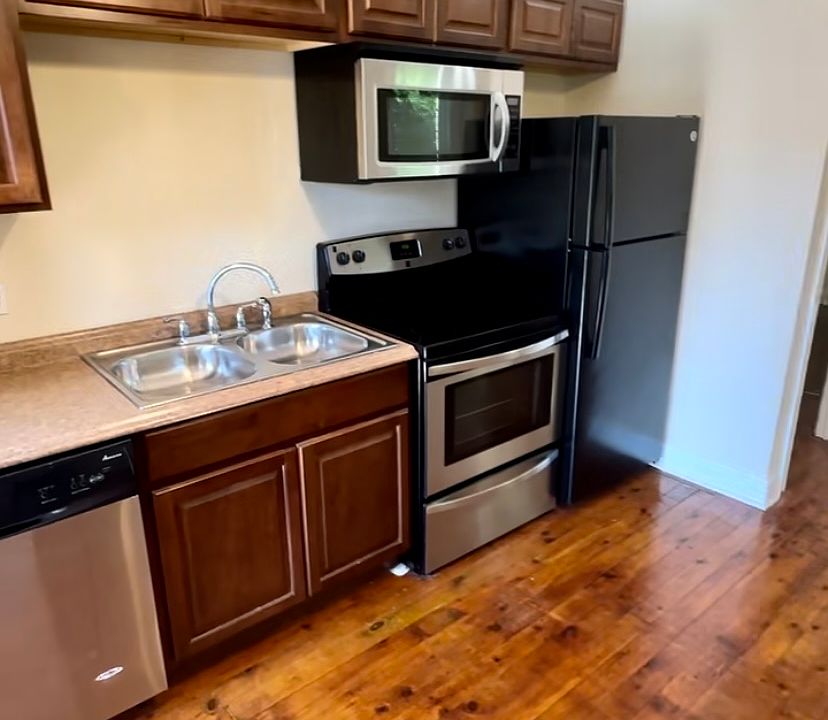 Full sized stainless steel/black appliances