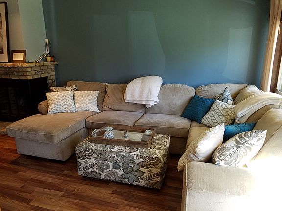 Living room is large enough for a large sectional