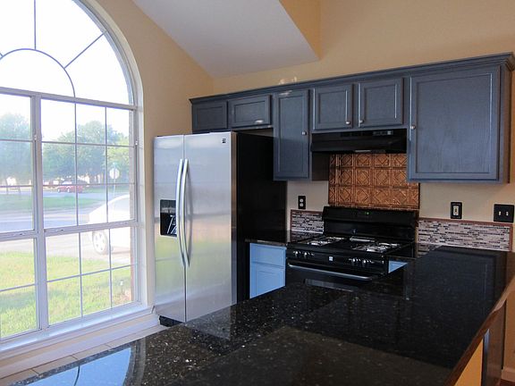 Kitchen with stainless fridge