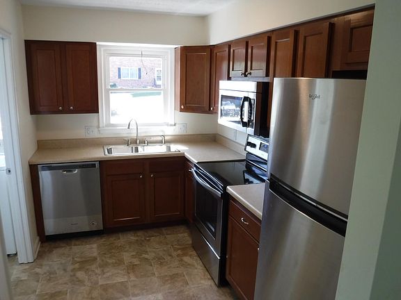 Nice kitchen with all new cabinetry, counter tops, sink, garbage disposal, flooring and Whirlpool Stainless Stell appliances