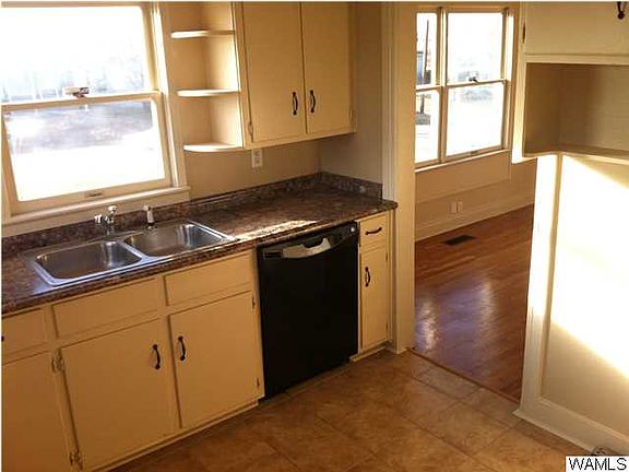 Spacious kitchen.  All appliances included: Refrigerator, Washer, Dryer. Laundry room off kitchen with side entrance door.