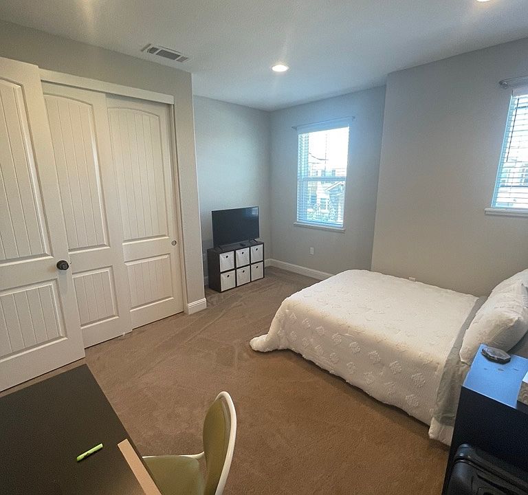 Furnished bedroom with dedicated work space.