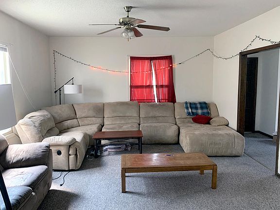 Living Room. The front door is seen from the hallway.