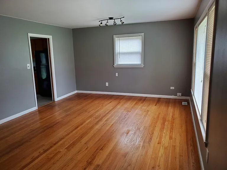 Sliding pocket door connects living room to the kitchen.