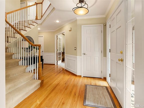 Upon entry, you are greeted by gleaming hardwoods that provide an effortless flow from room to room.