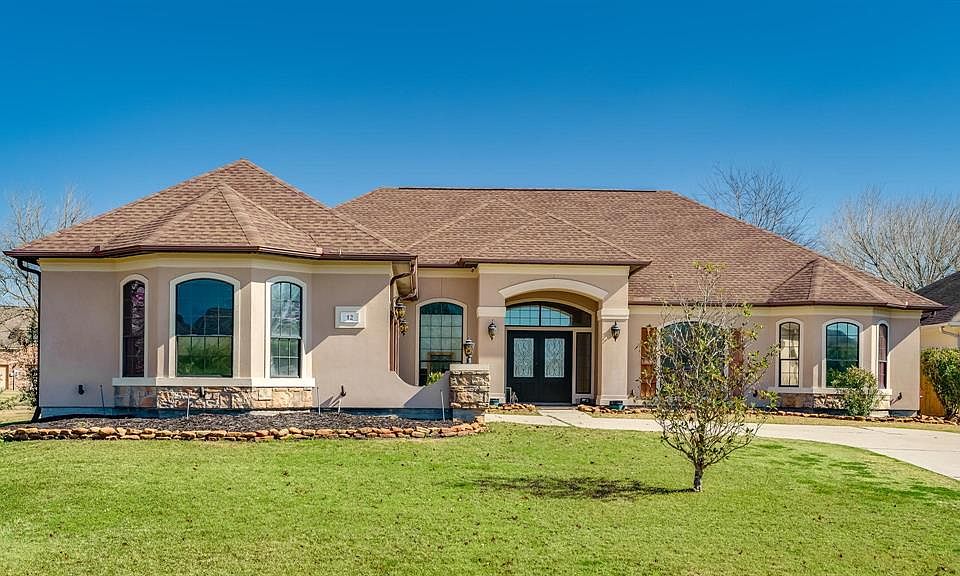 Welcome home to this captivating one story mediterranean home full of upgrades and custom features.