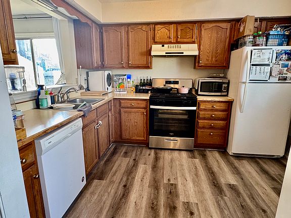 Kitchen with new dishwasher and stove