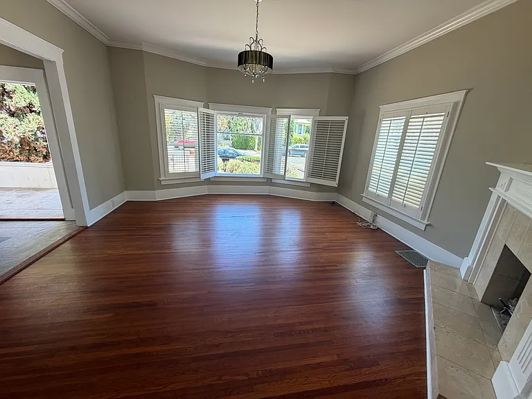 Bright Living room - gleaming hardwood floors - gas fireplace