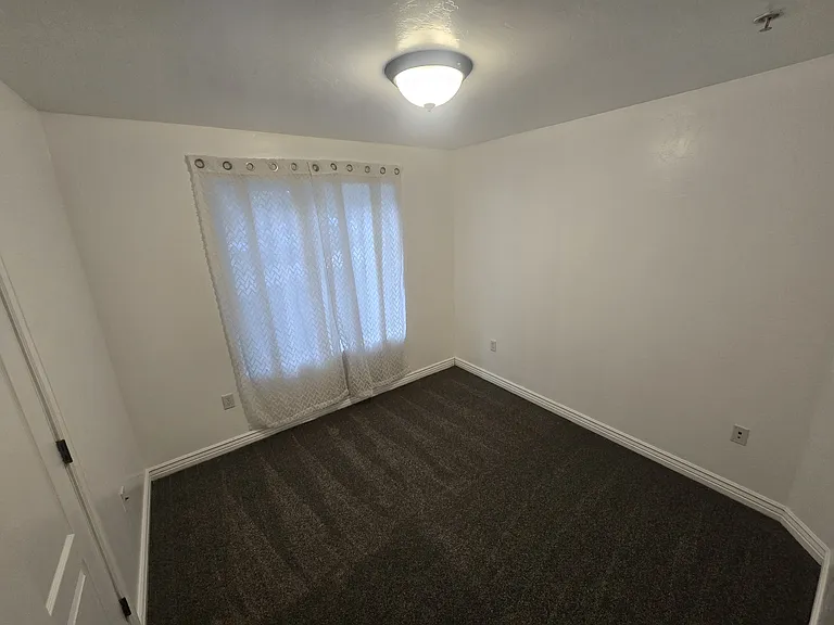 Bedroom #2, complete with fresh paint and new carpet.
