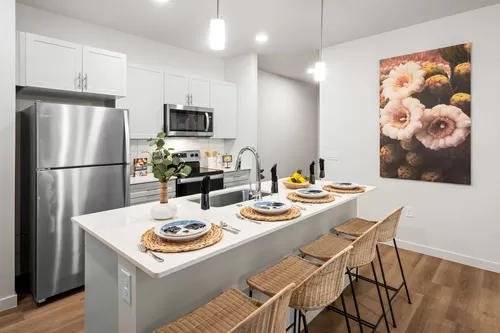 Open and bright modern kitchen with island seating - Acero Queen Creek