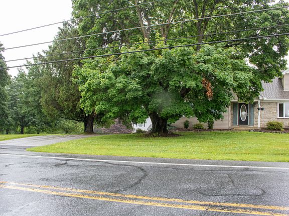Front with driveway on left