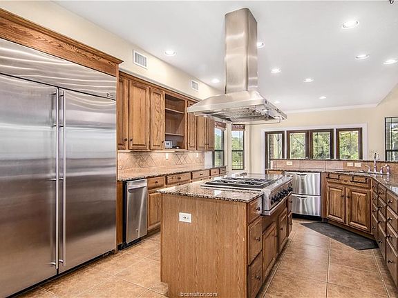 Chef's Dream Kitchen, with high end applicances including GE Monogram. Granite Counter tops. Oak Cabinets.