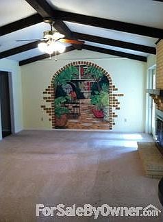 Den : Mural of New Orleans courtyard is by a Revel artist