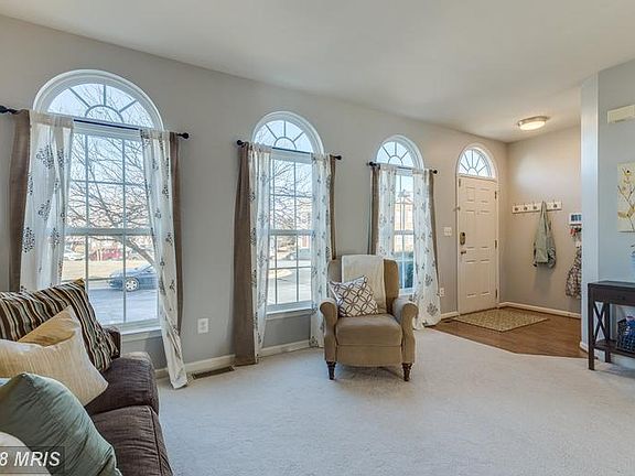 Enter into the foyer which opens up to living room