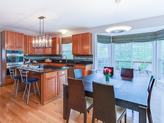 Breakfast room and kitchen combination - bay window overlooks the deck.
