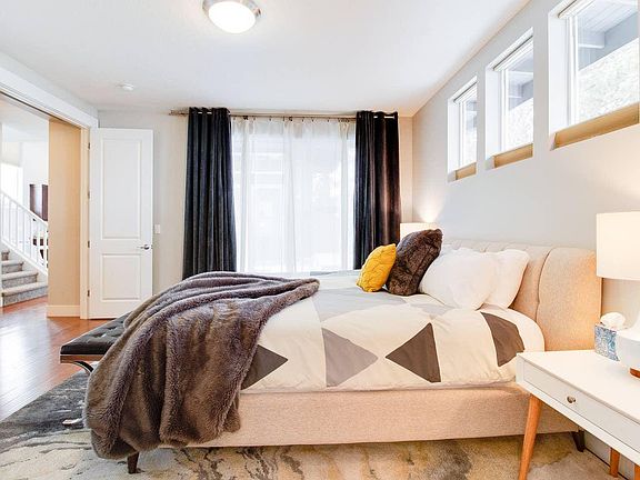 Primary Suite has sliding glass window out to the courtyard and adjoining bathroom with dual vanities