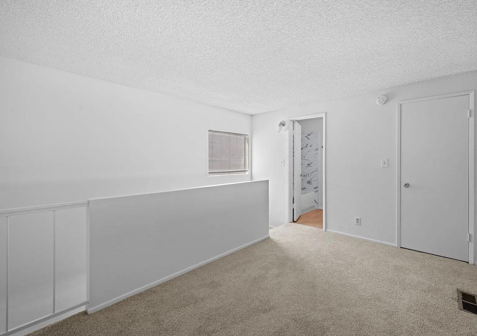 Top-Floor 1-Bedroom Condo with Vaulted Ceilings and Private Balcony — Photo 4