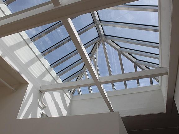Incredible historic skylight has motorized blinds over the bedroom section.